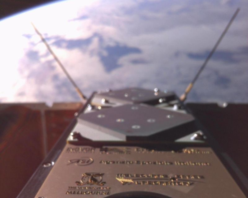 The first image taken by the SpIRIT selfie camera, acquired over New Zealand at the end of the thermal radiator deployment sequence. The camera captures the underside of SpIRIT satellite, where mission participant logos are printed.
