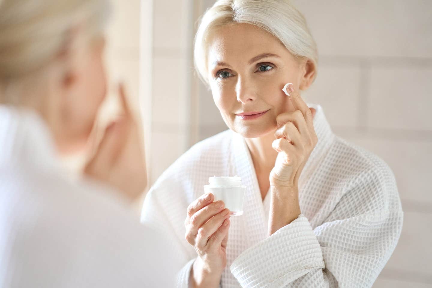 Vitamin C helps thicken aging skin by reactivating genes through DNA demethylation, boosting epidermal renewal and strength.