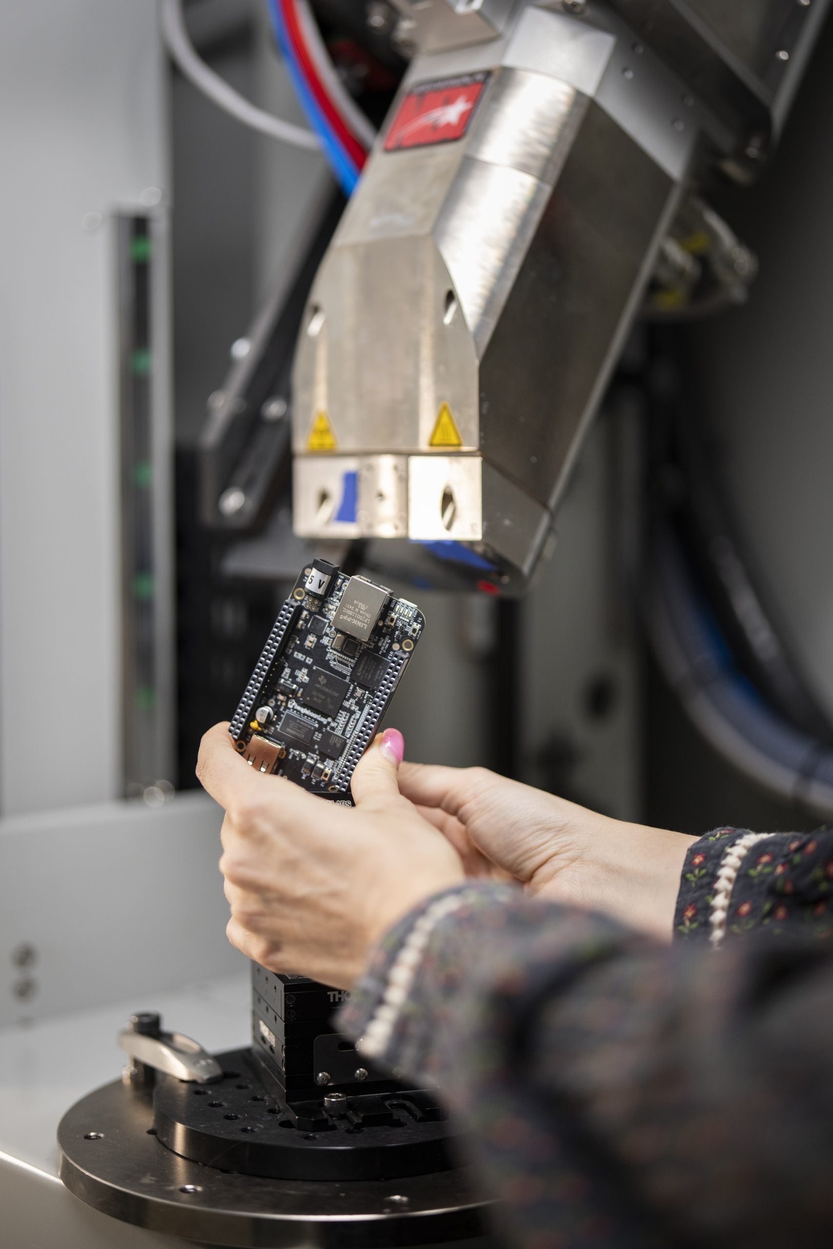 Noelle Collins uses ball calibration while setting an X-Ray CT scan.