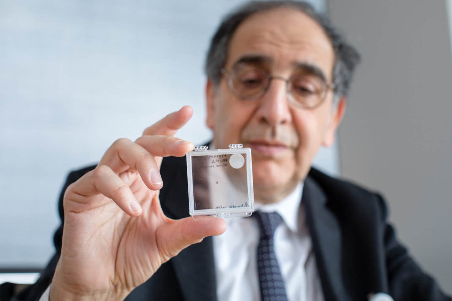 José-Alain Sahel, M.D., holding the PRIMA implant.