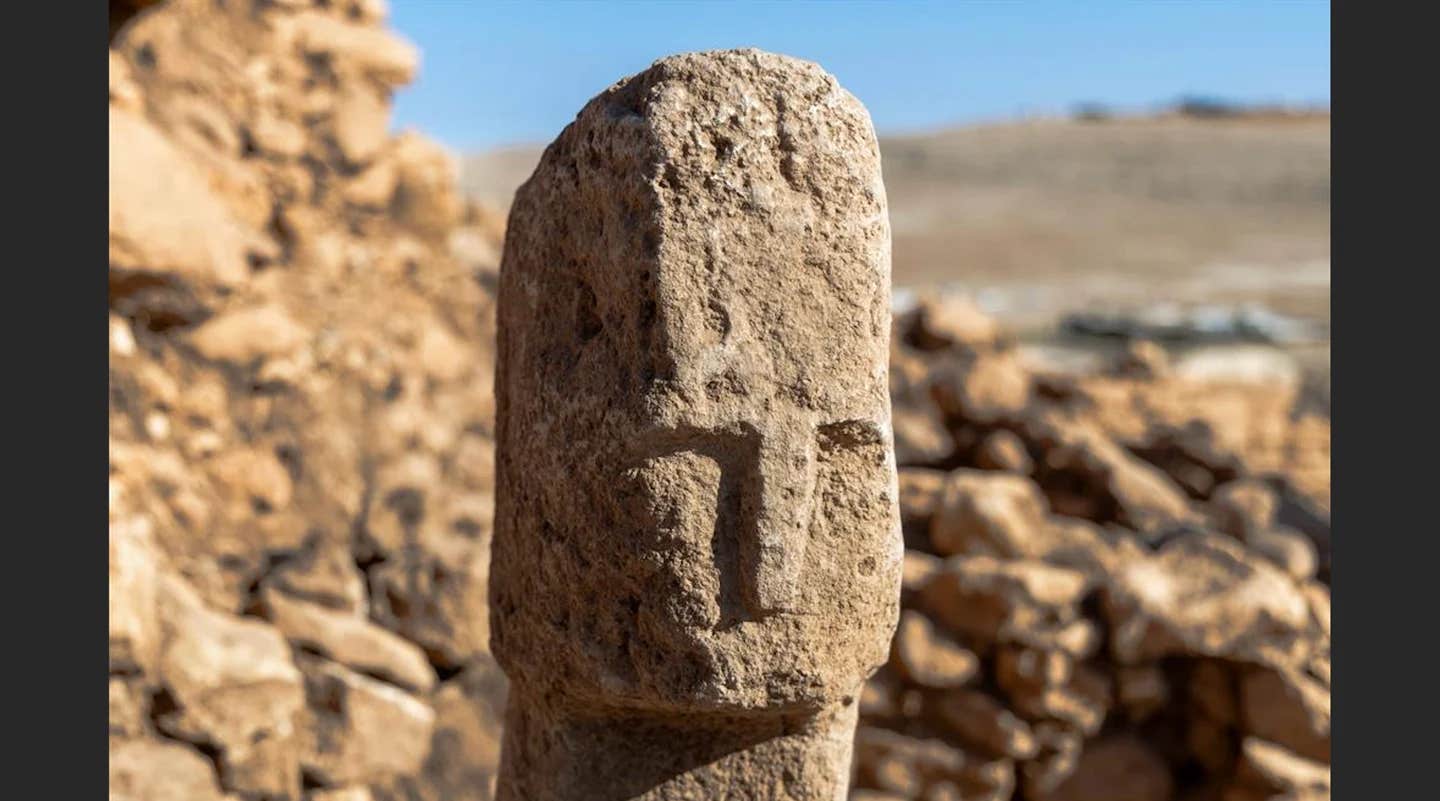 Archaeologists in Turkey have found a 12,000-year-old stone pillar with a carved human face—the oldest known example of self-expression and artistry.