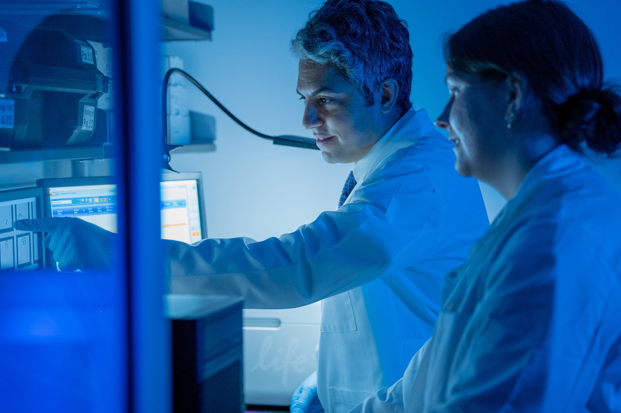 Elias Sayour (left) works in the lab.