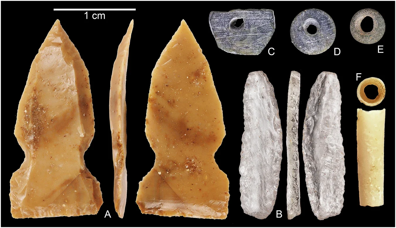 Stone tools and beads recovered from excavations.