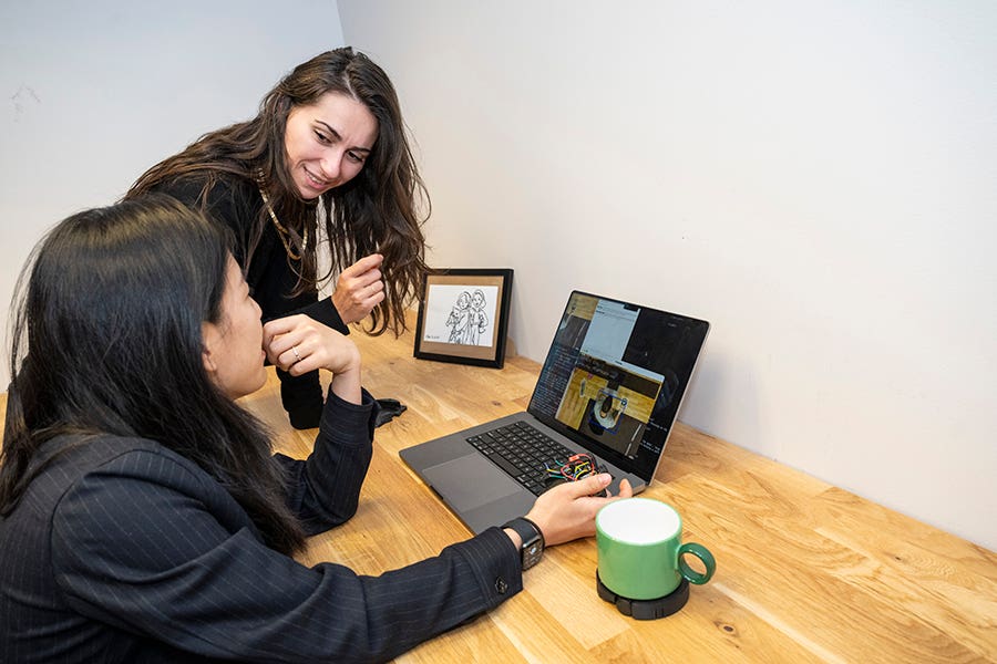 PhD student Violet Han, foreground, and Assistant Professor and Interactive Structures Lab Director Alexandra Ion with their wheeled robot prototype.