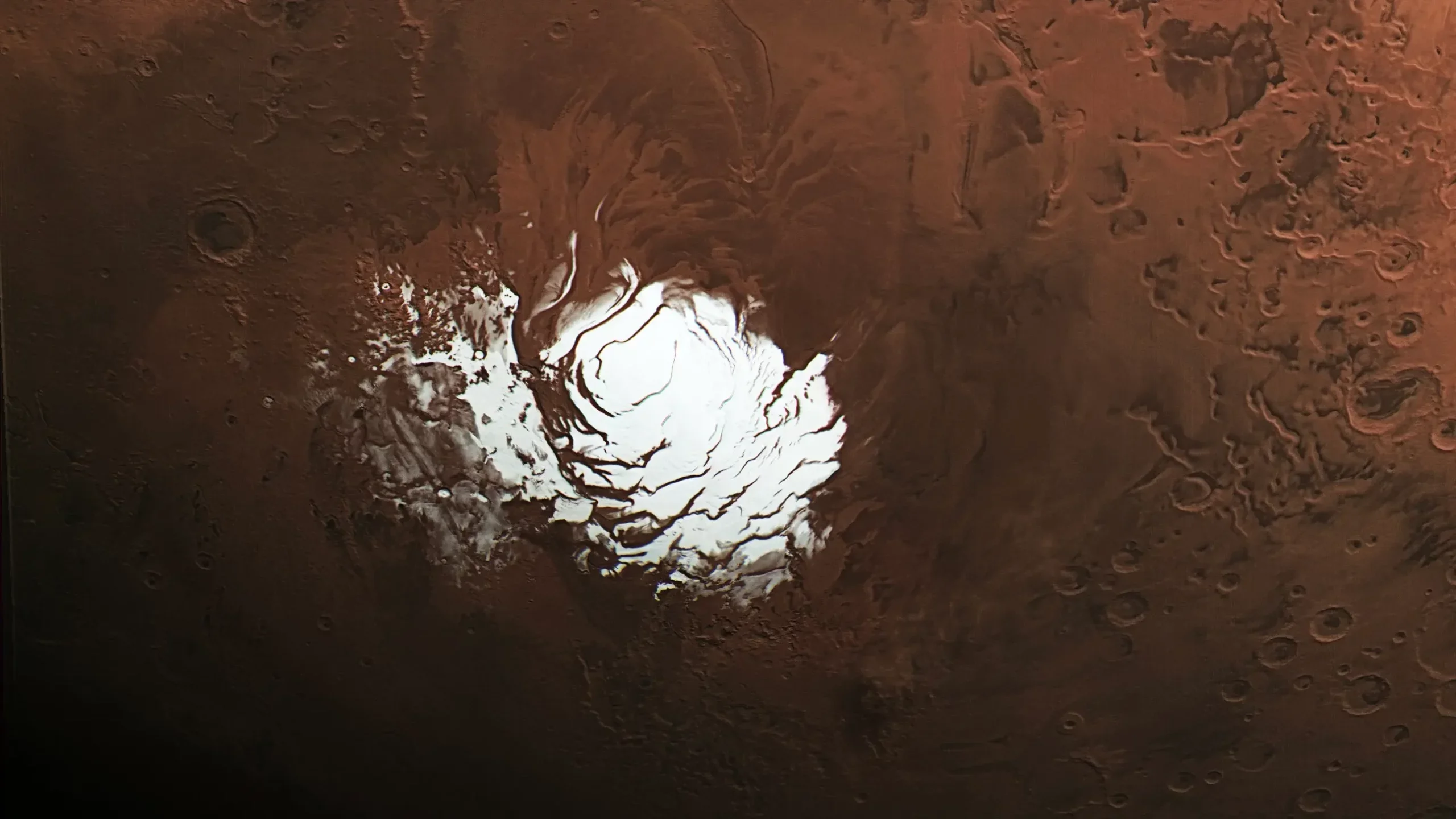 The European Space Agency’s Mars Express orbiter captured this view of the planet’s south polar ice cap on Feb. 25, 2015. Three years later, it picked up a signal from a region just to the right of the ice cap, which scientists interpreted as evidence of an underground lake.