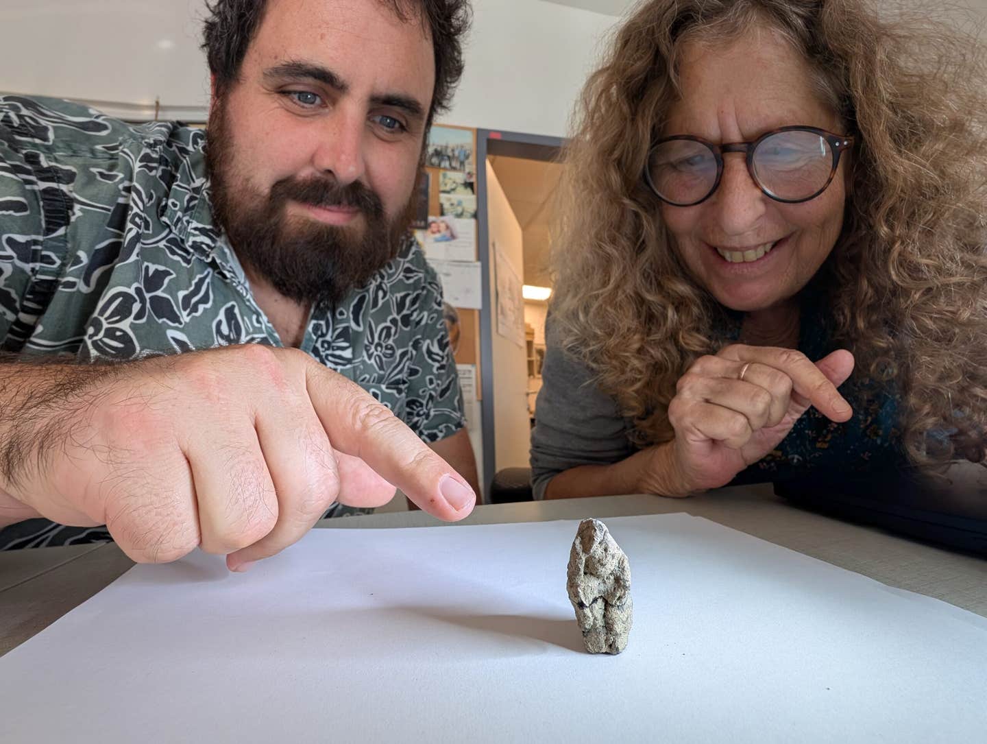 Prof. Leore Grosman and Dr. Laurent Davin, with the figurine.