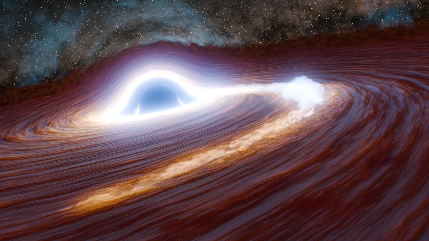 This artist's concept depicts a supermassive black hole in the process of shredding a massive star—at least 30 times the mass of our Sun—to pieces.