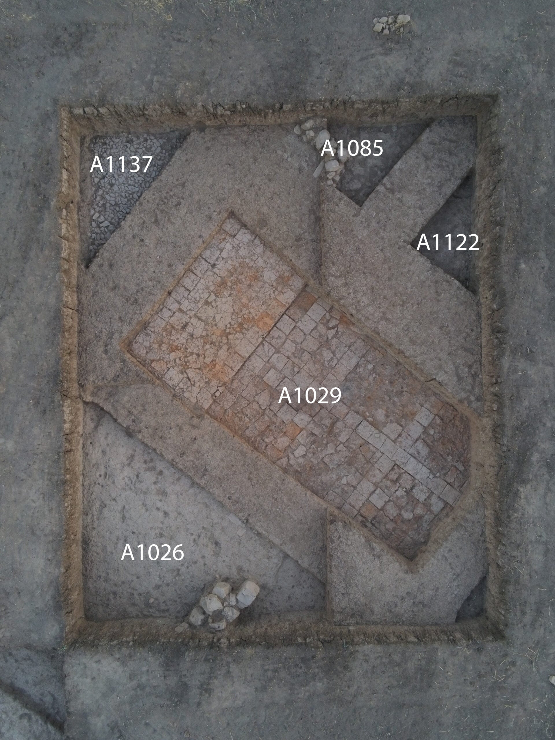 Room with brick floor in Area A.