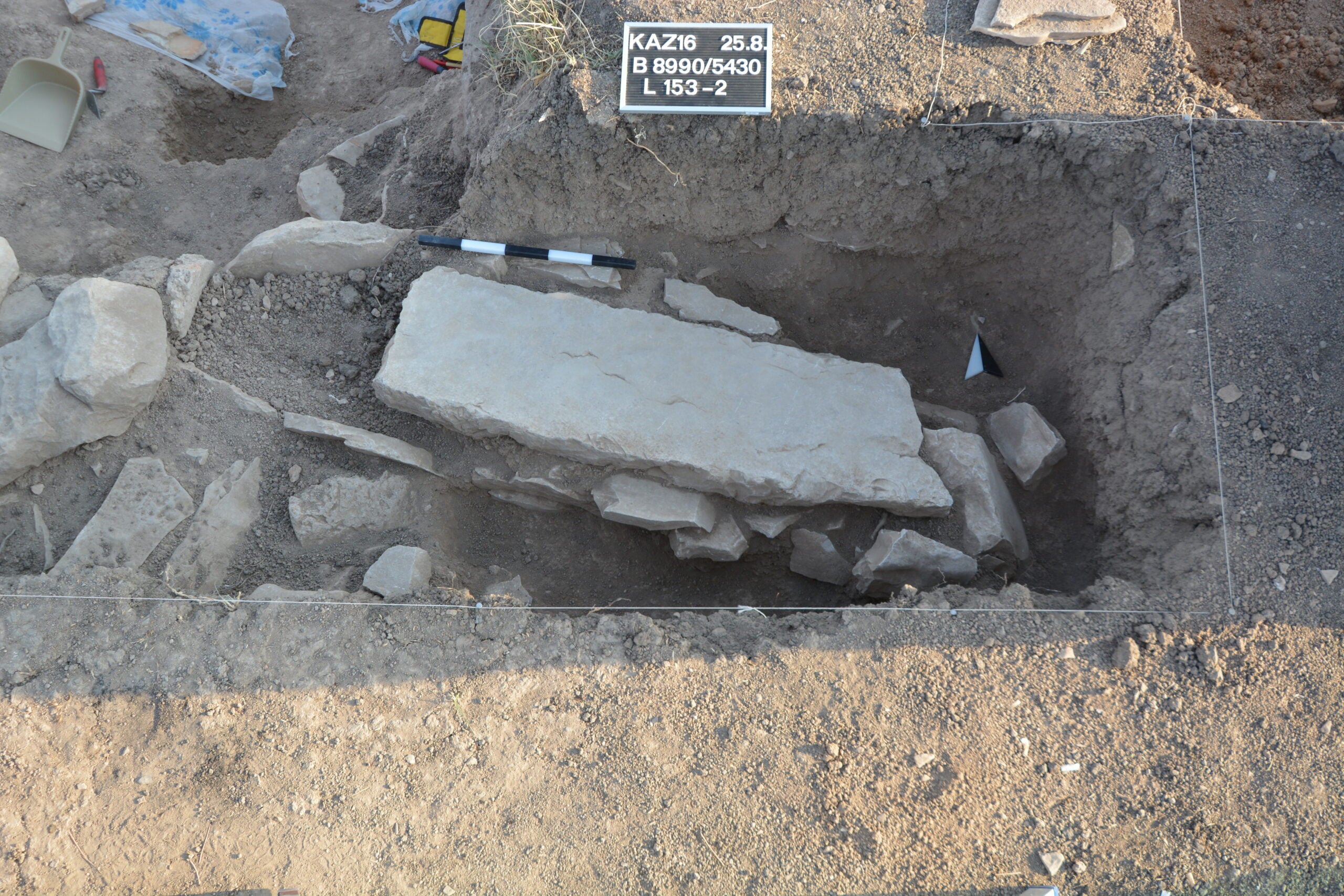 Excavation of a grave in Area B.