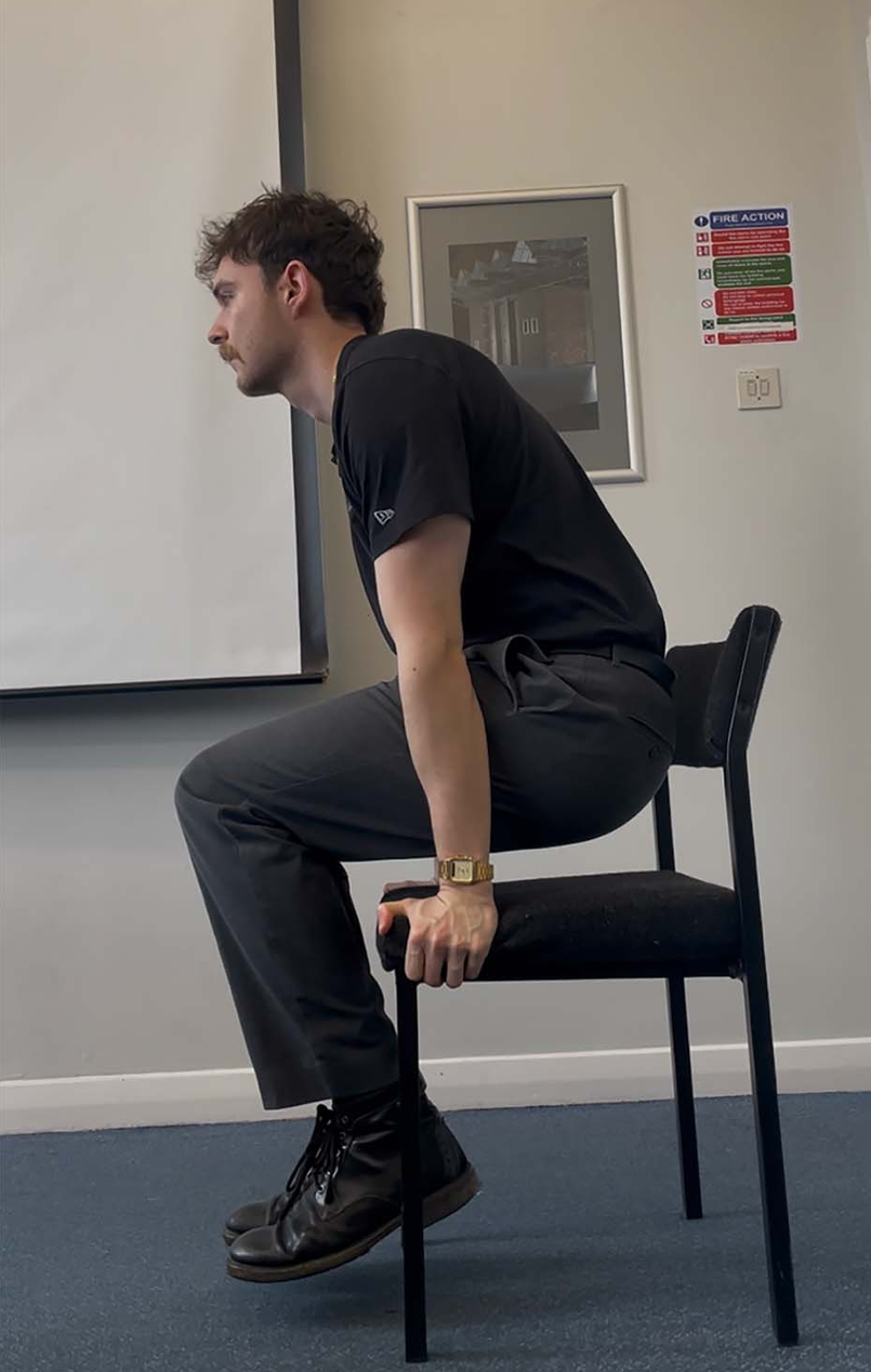 The task required participants to raise and then support their body weight on their hands against the chair seat for as long as possible. 