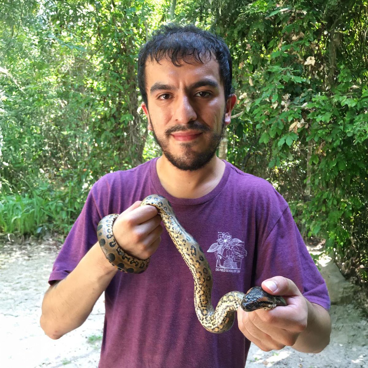 Alfonso Rojas holding a baby anaconda. 