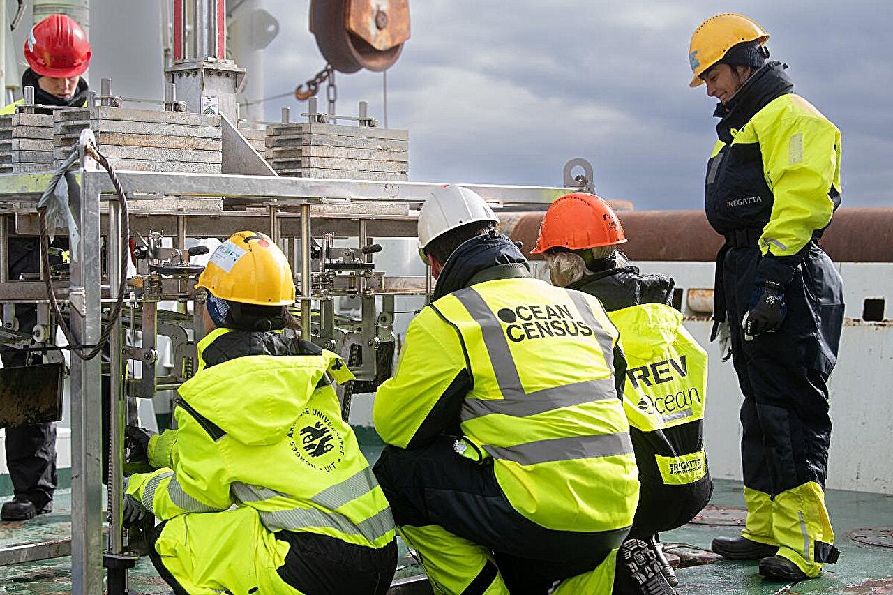 Expedition participants from UiT, Ocean Census and REV Ocean, inspect equipment on deck during Ocean Census Arctic Deep 2024. 