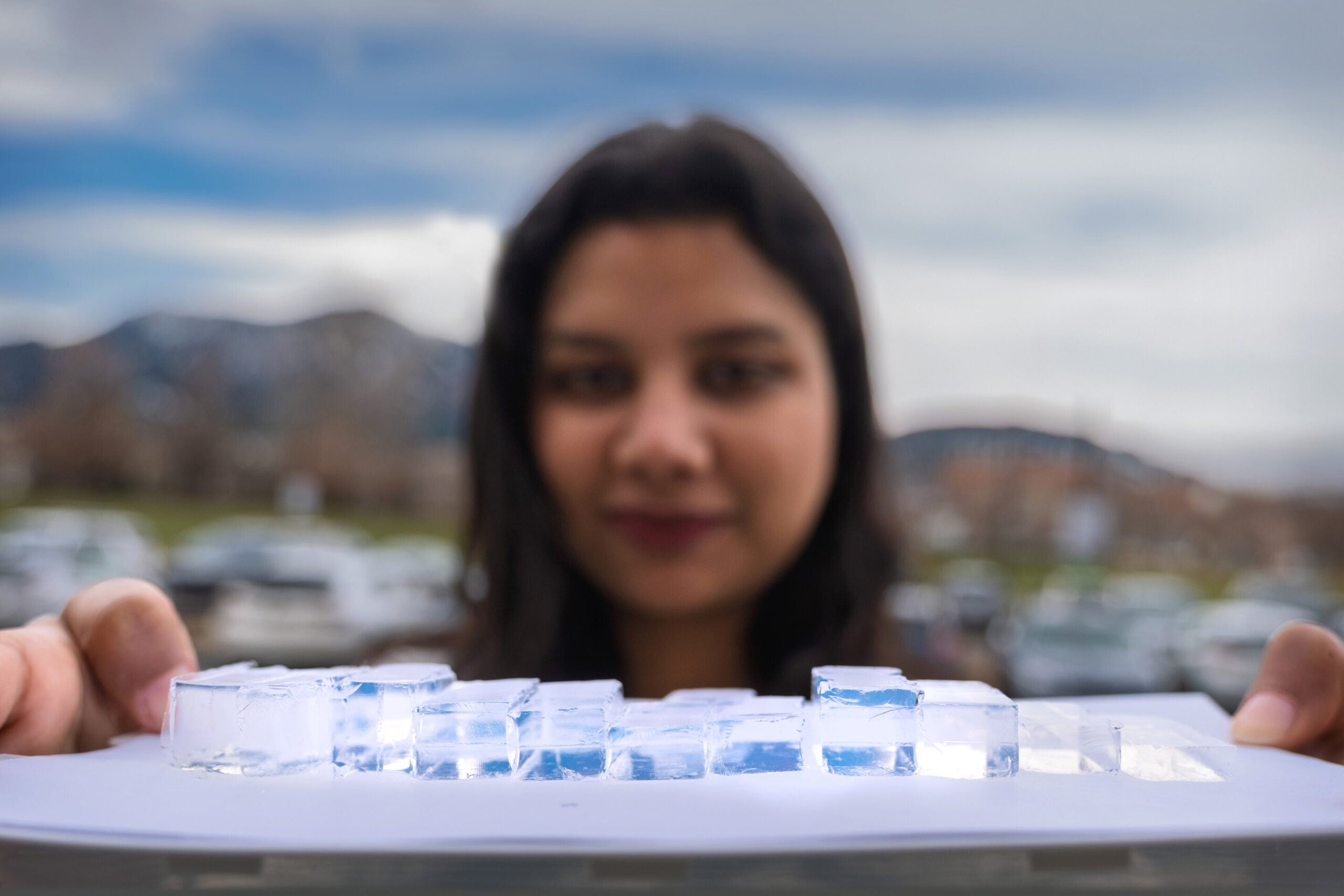 Shakshi Bhardwaj holds up blocks of MOCHI in different sizes.
