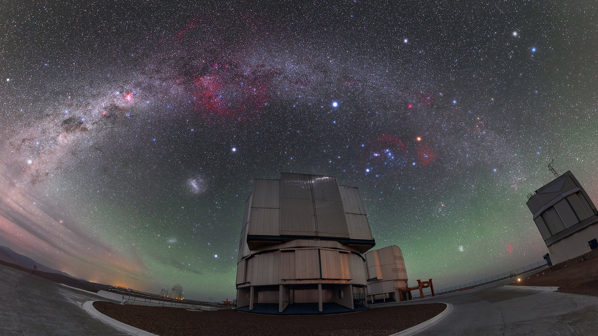 The sky above ESO’s VLT (Very Large Telescope) in Chile. The star R Doradus lies just to the left of the telescope at the centre of the image, close to the Large Magellanic Cloud, here visible as a bright fuzzy patch in the sky. 