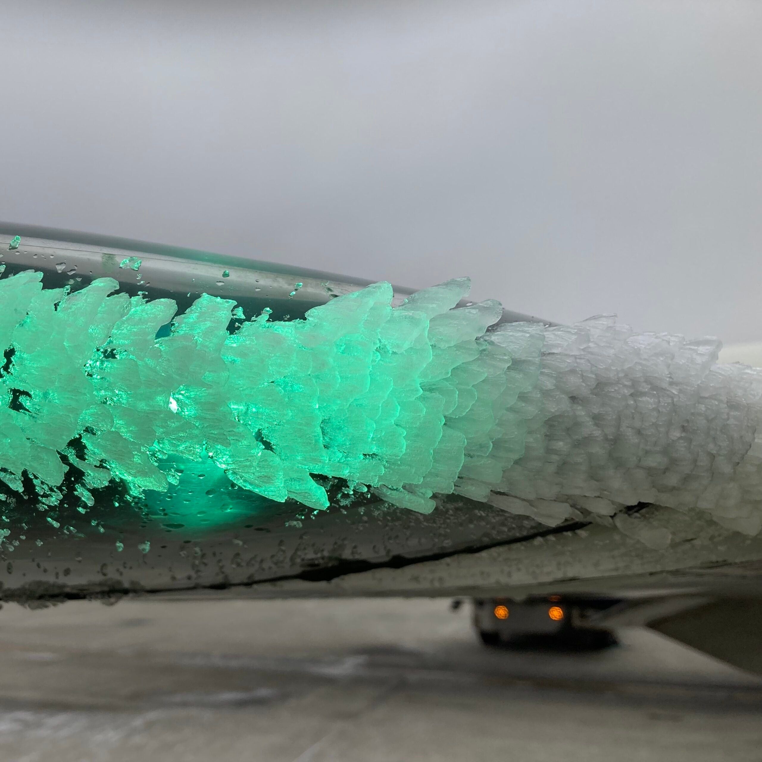 Ice build-up on the wing of a commercial airplane. Ice can impair airplane performance, increasing the risk of crashes.