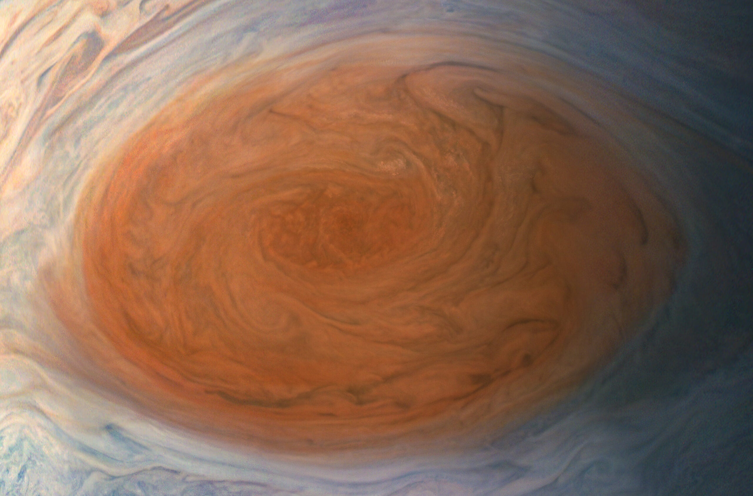 Early telescope users recorded what is now known as the Great Red Spot, a vast storm twice Earth’s size that still rages today.