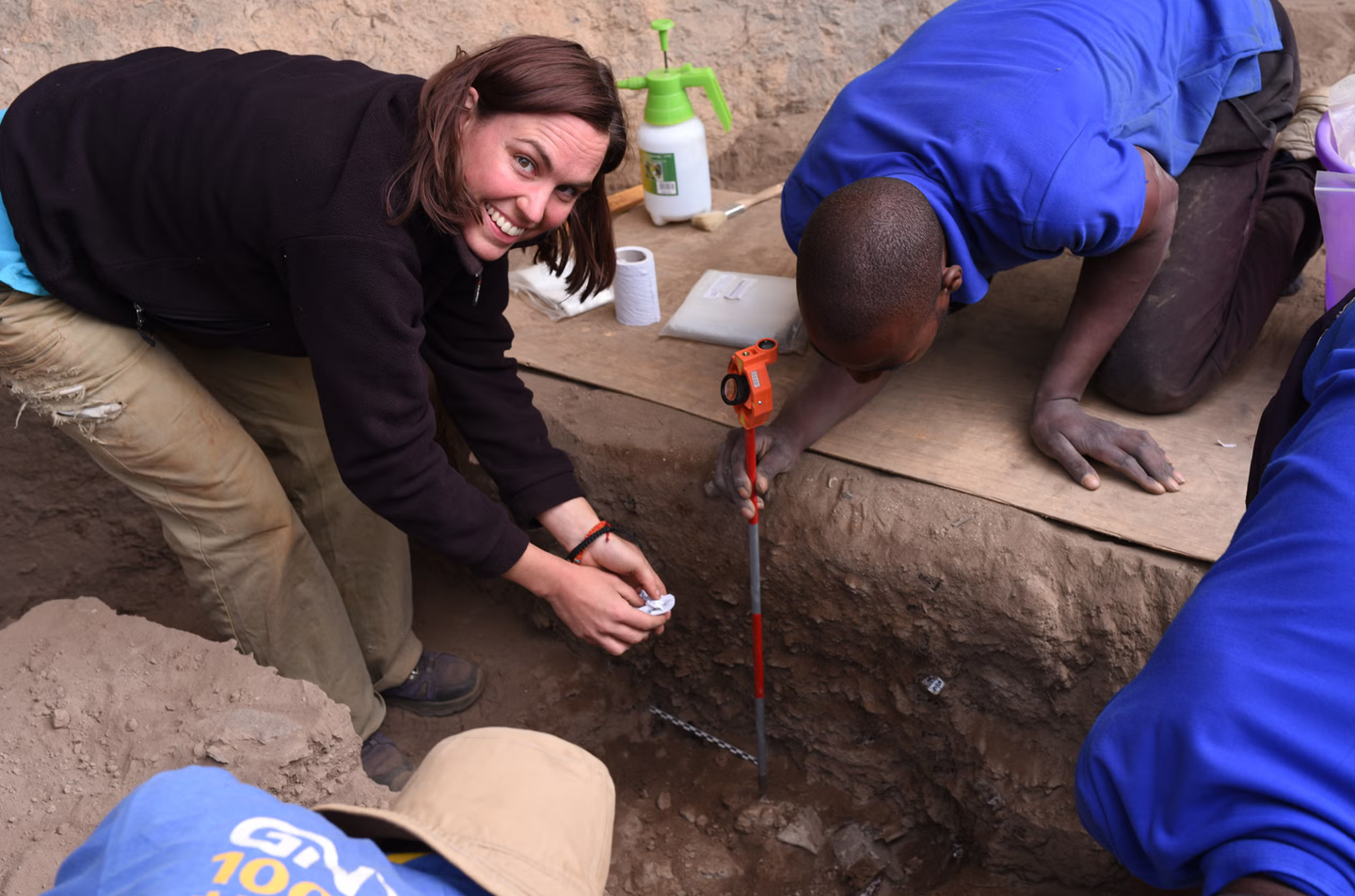 Jessica Thompson and team members excavating and mapping the pyre.