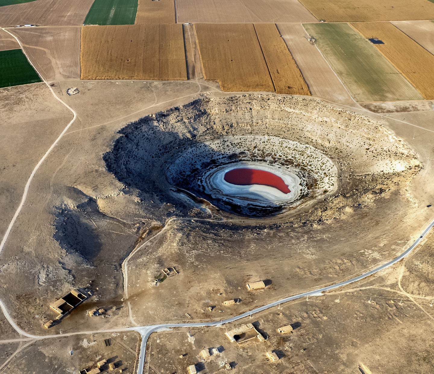 The Visible Face of Water Bankruptcy: This sinkhole in the Konya Plain, Türkiye, represents the literal collapse of the landscape under hydrologic liquidation. As of late 2025, nearly 700 such caverns scarred Türkiye’s agricultural heartland—a direct result of extracting groundwater much faster than nature can replenish it. 