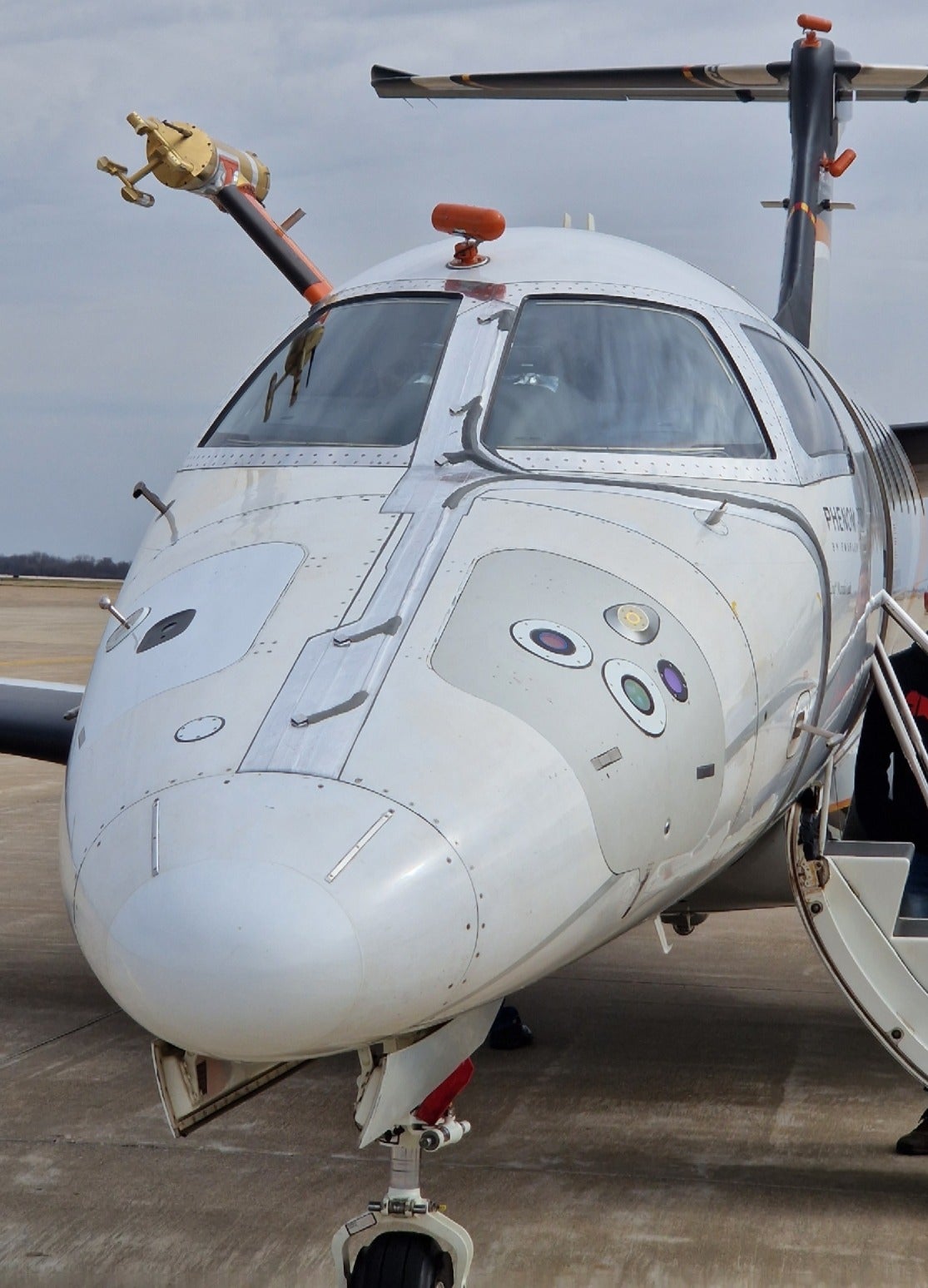 Renno's optical and microwave sensors for detecting ice and freezing rain were embedded into the nose of a small business jet. The green circle on the right is the optical sensor, and the yellow circle on the right side is the microwave sensor.