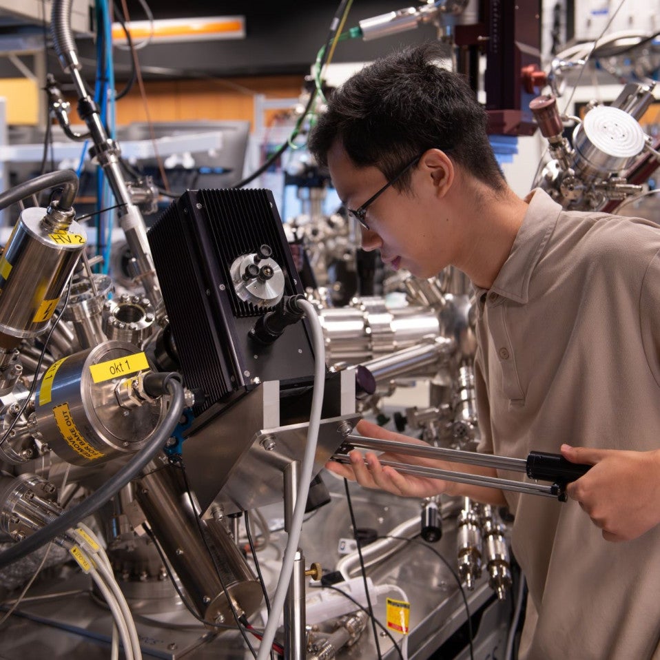 The time- and angle-resolved photoemission spectroscopy (TR-ARPES) setup at OIST, here with study co-first author Xing Zhu, PhD student in the Femtosecond Spectroscopy Unit. 