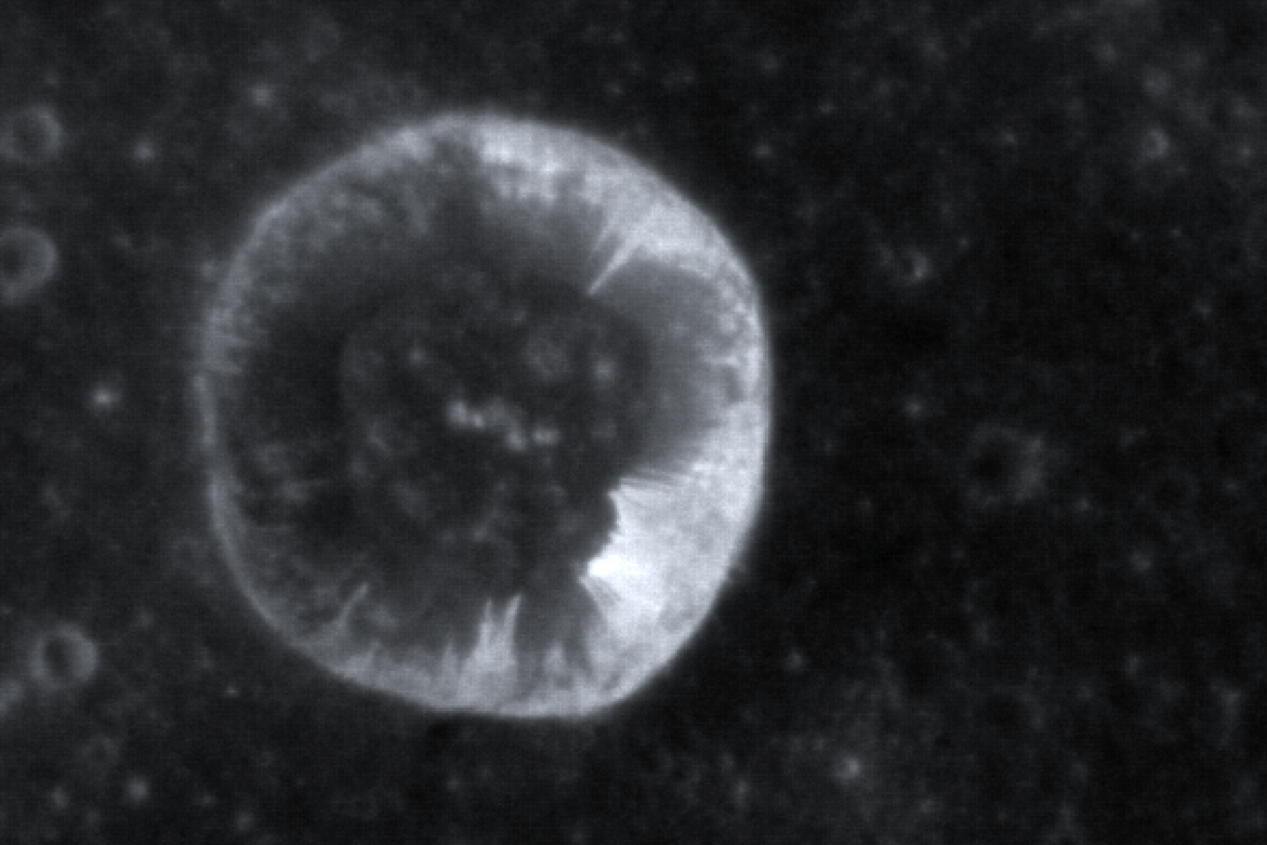 Image of the streaks or “lineae” on the slopes of a crater wall on Mercury and the bright hollows from which the streaks originate. The image was taken by MESSENGER on April 10, 2014.