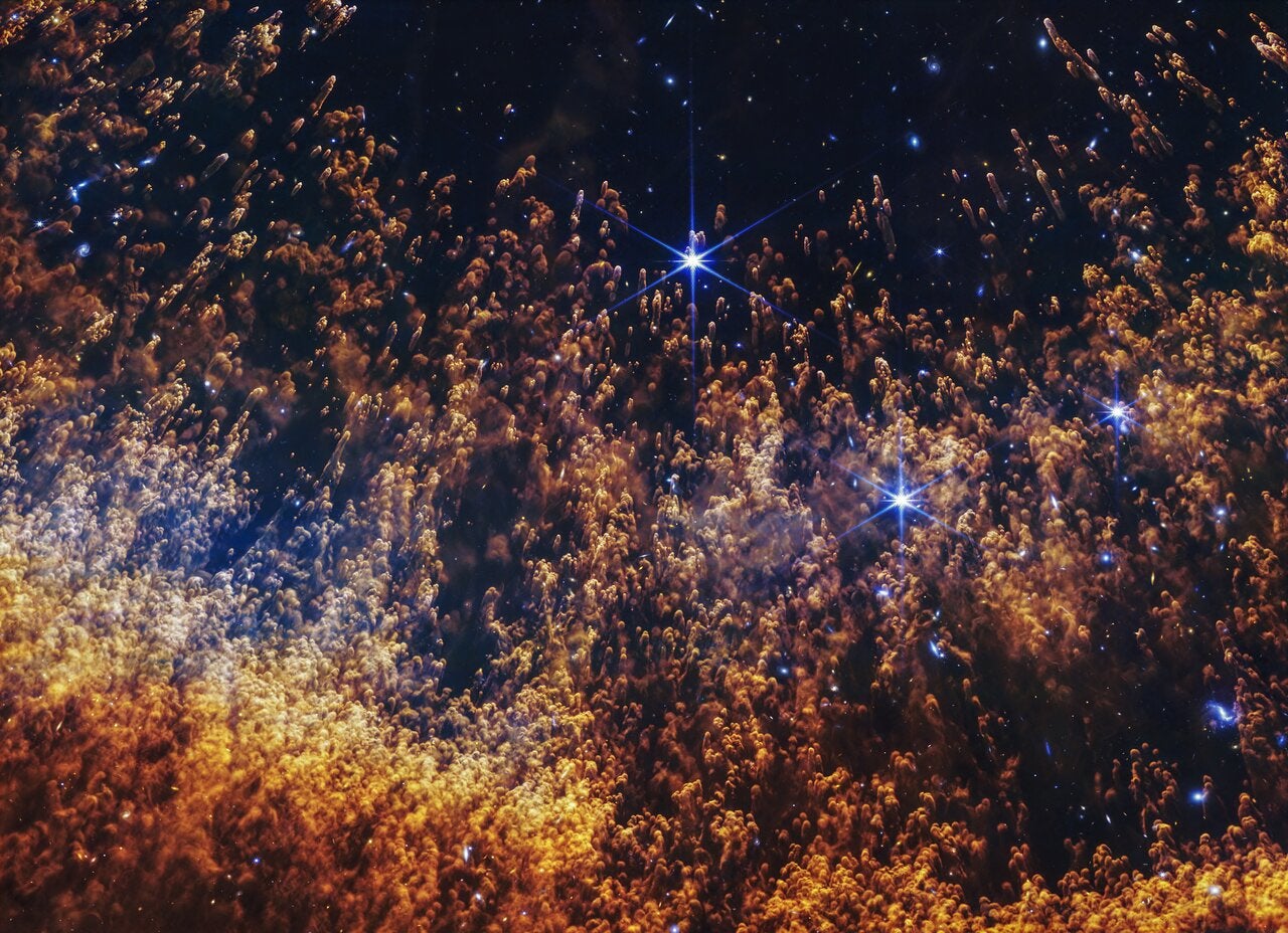 A new image from the James Webb Space Telescope of a portion of the Helix Nebula highlights comet-like knots, fierce stellar winds, and layers of gas shed off by a dying star interacting with its surrounding environment.