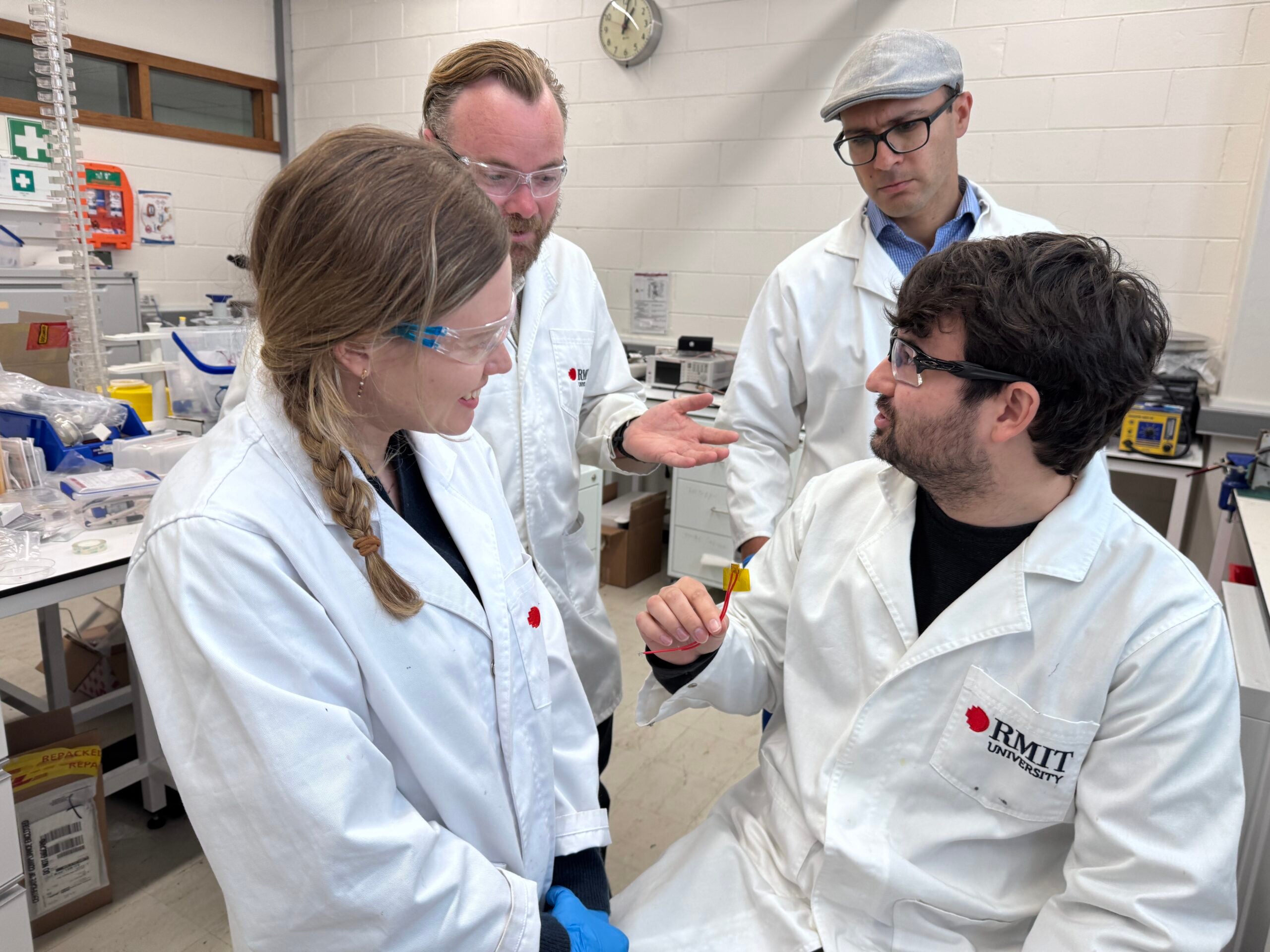 Members of the RMIT University research team with the newly developed nylon‑film energy‑harvesting device. Pictured (L–R): Dr Yemima Ehrnst, Dr Peter Sherrell, PhD researcher Robert Komljenovic and Associate Professor Amgad Rezk.