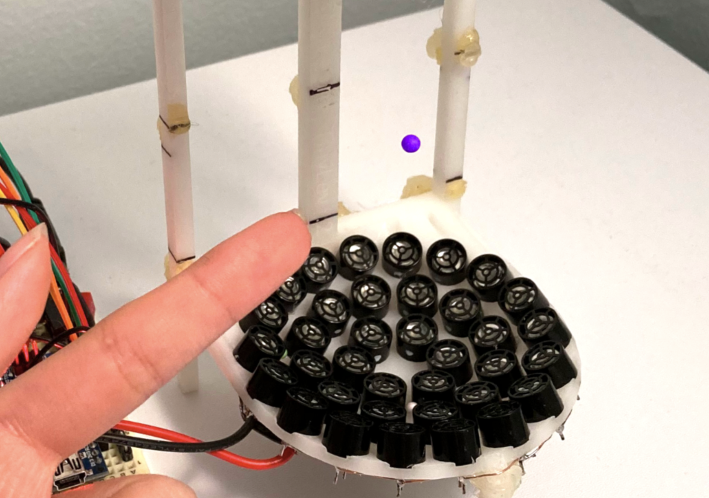 NYU physicists discover a simple time crystal using levitated foam beads and sound waves, revealing motion that breaks classic physics rules.