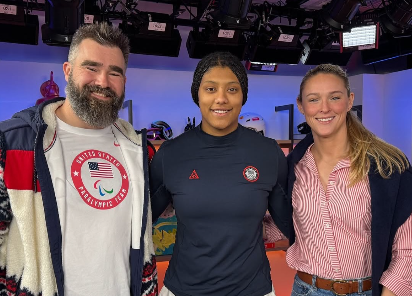Jason Kelce and his wife, Kylie, posing with Laila Edwards at the Olympics. 