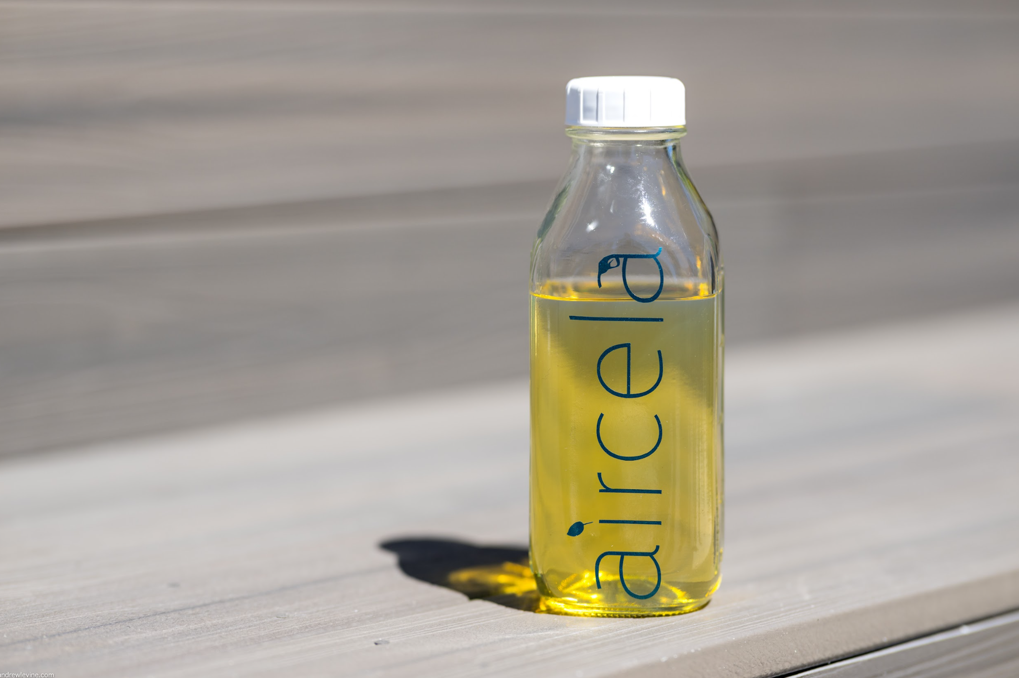 Bottle with gasoline made on-site—produced in real time by the Aircela machine