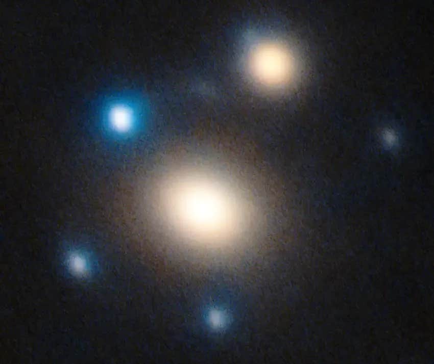 High-resolution image taken with the Large Binocular Telescope on Mount Graham in Arizona, USA, displaying the two lens galaxies in a warm tone, and the five lensed copies of SN Winny in blue.