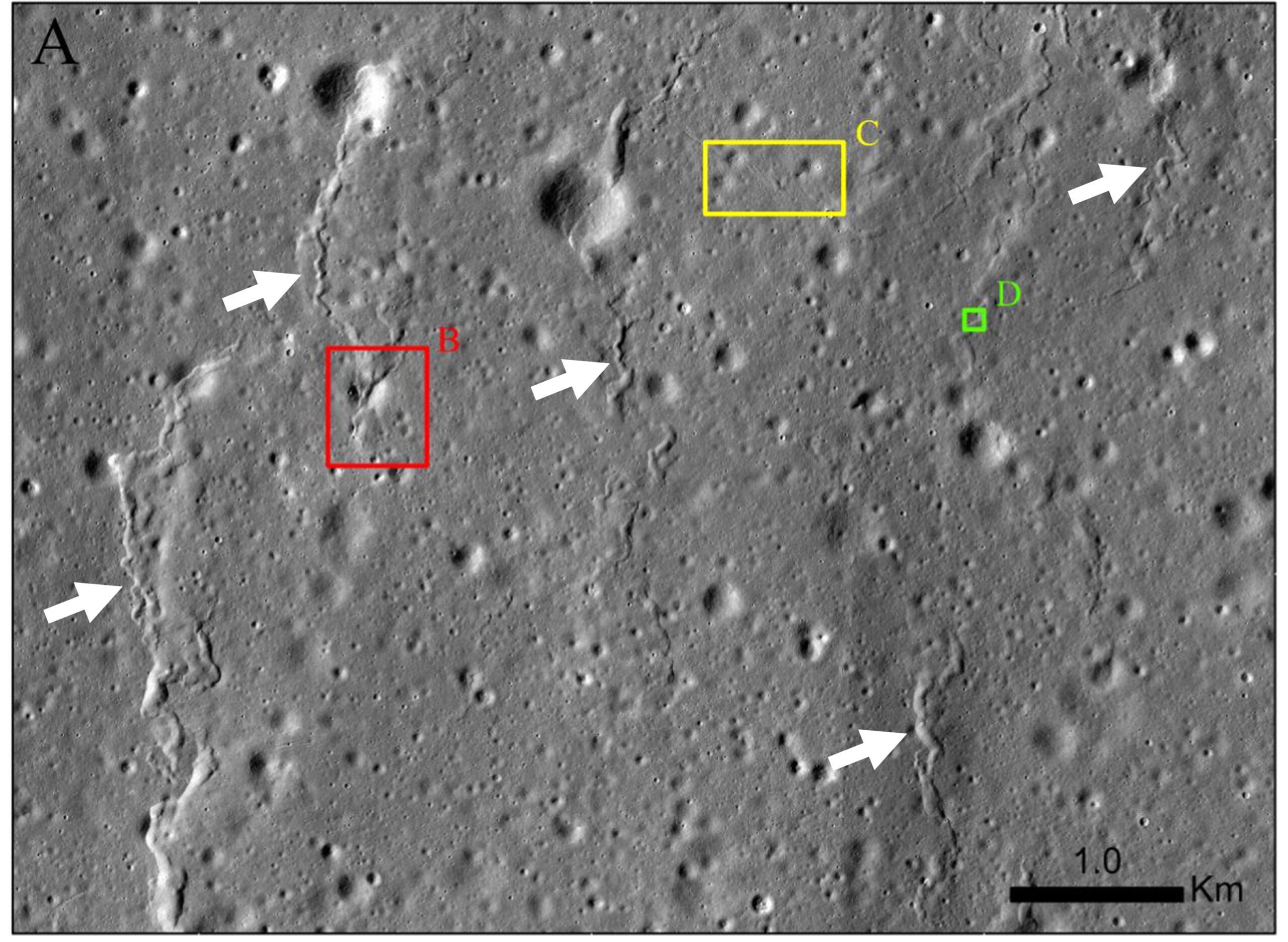 An SMR cluster in Mare Humorum containing several north–south oriented SMR segments (white arrows; LROC NAC M1203880892R, M1234474596L, and M1234474596R).