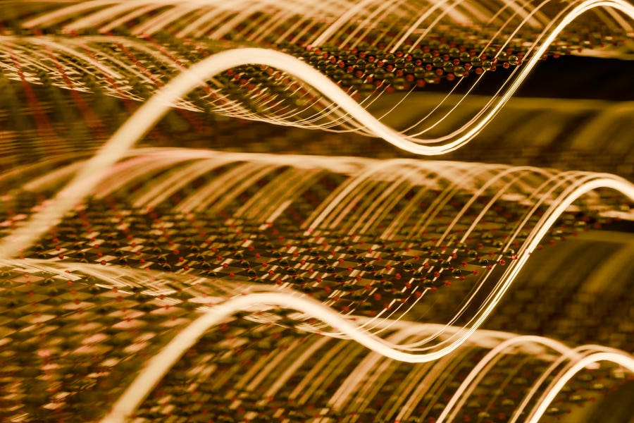 An artist’s depiction of a superfluid plasmonic wave. With the terahertz scope, the team observed a frictionless “superfluid” of superconducting electrons that were collectively jiggling back and forth at terahertz frequencies.