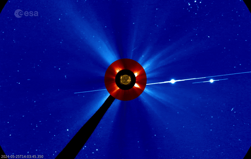 This video combines images of the Sun taken by NASA's Solar Dynamics Observatory with coronagraph images taken by the ESA/NASA SOHO mission LASCO C2 (red) and C3 (blue) instruments. The bright spots to the right of the Sun are Jupiter and Venus.