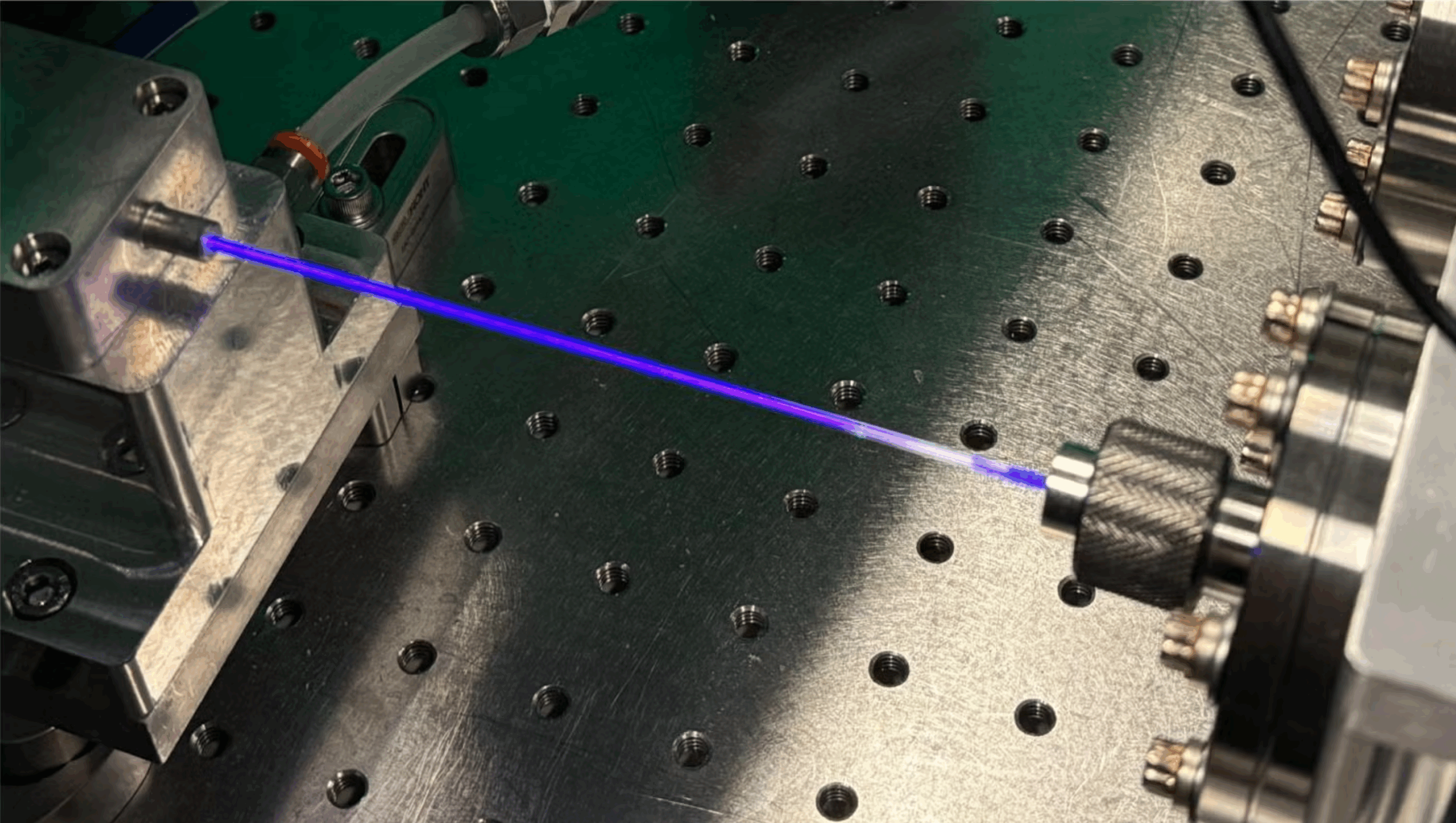 A specially designed chamber that converts visible light into vacuum ultraviolet light in a new laser. 