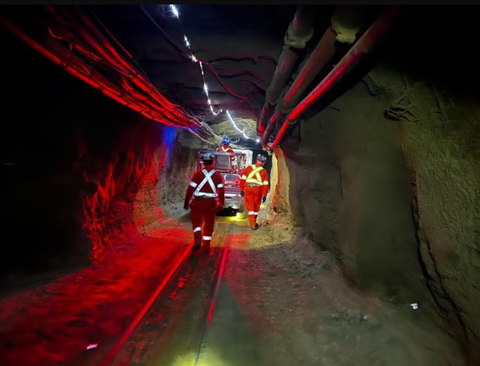 SNOLAB staff escort the SuperCDMS dilution fridge 1.2 kilometers through the mine drift to the lab entrance. 
