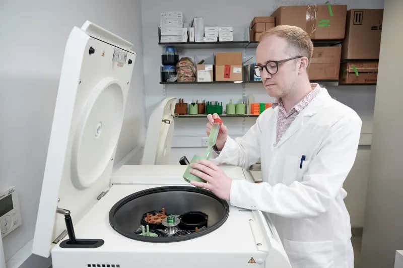 Professor Stephen Wallace harvesting engineered bacteria for analysis.