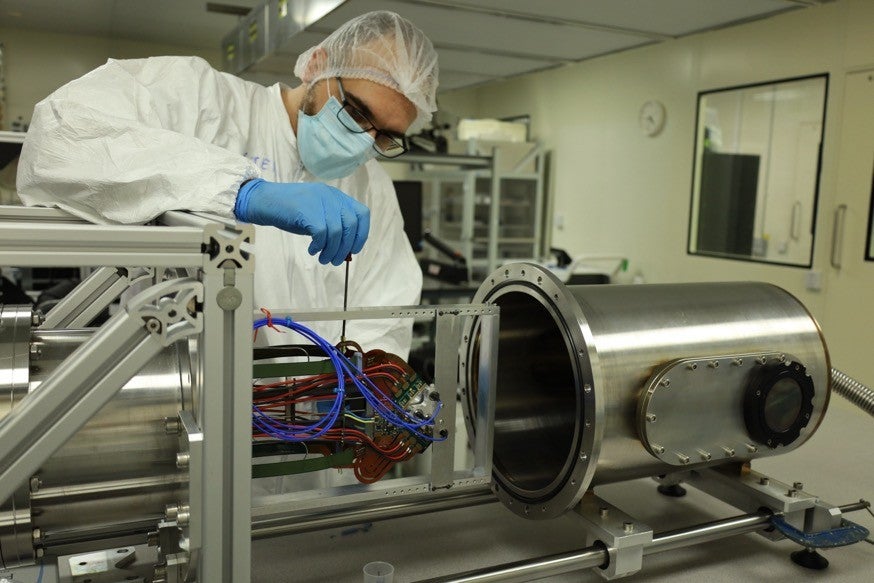 Dr Stefano de Capua testing the LHCb silicon detector modules in the Schuster Laboratory clean-rooms at the University of Manchester.