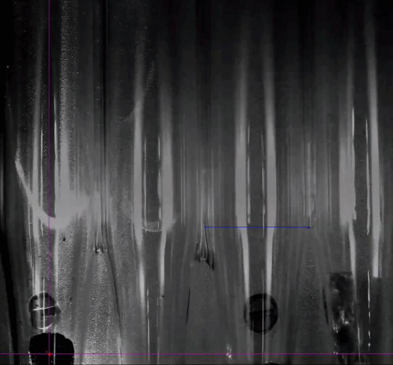 Inside a vacuum chamber, a continuous laser fired at three tiny graphene aerogel cubes, while a high-speed camera captured every moment through glass tubes.