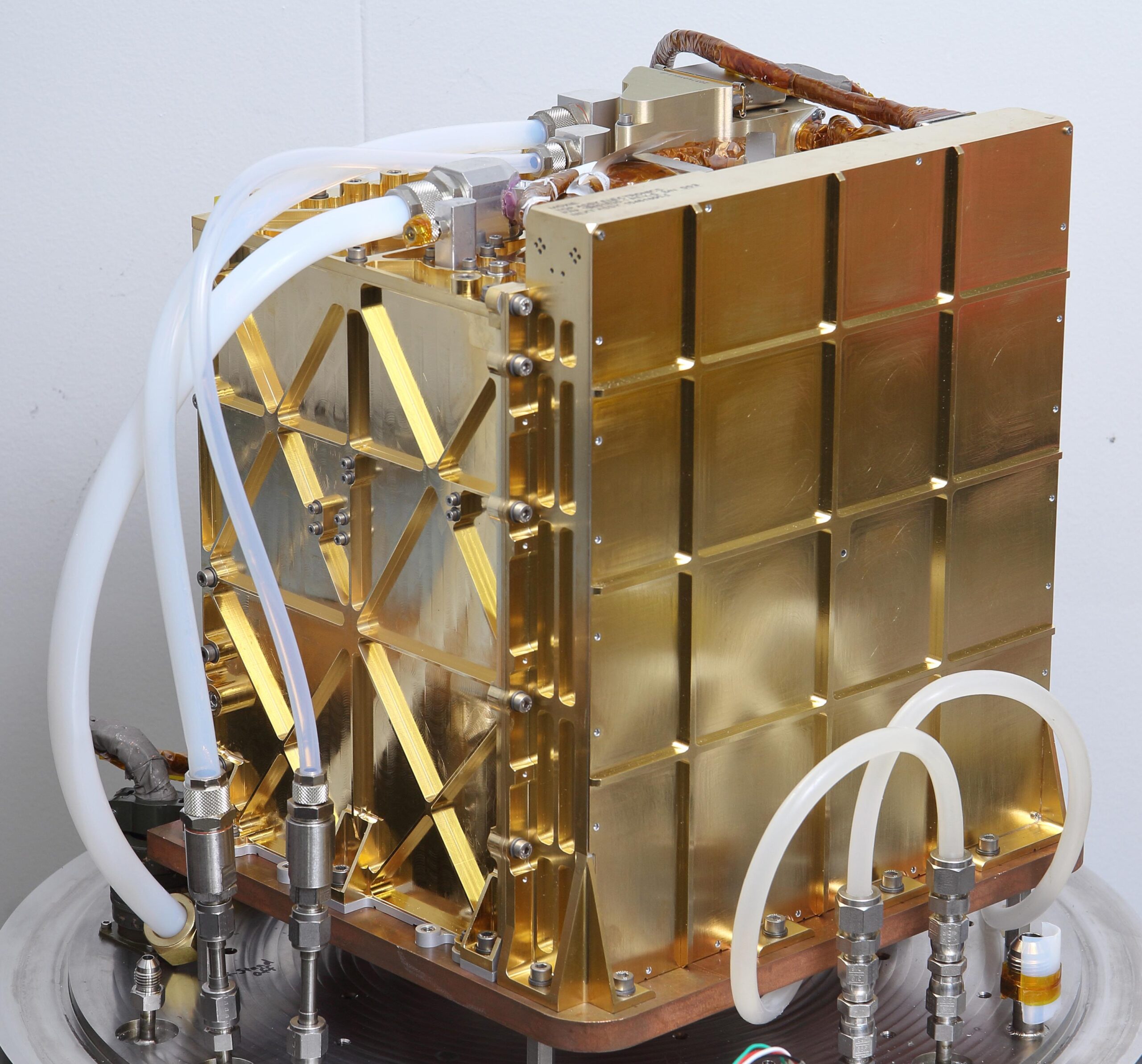 The engineering model (EM), an almost identical twin of MOXIE, is used for testing in the lab at NASA's Jet Propulsion Laboratory in Pasadena, California. Inside this gold-plated aluminum box is the Solid Oxide Electrolysis unit, or SOXE, the heart of MOXIE. Using an electrochemical process called electrolysis, SOXE takes in the carbon dioxide gas and splits it into carbon monoxide and oxygen, which is measured for purity, filtered, and then released back into the Mars atmosphere.
