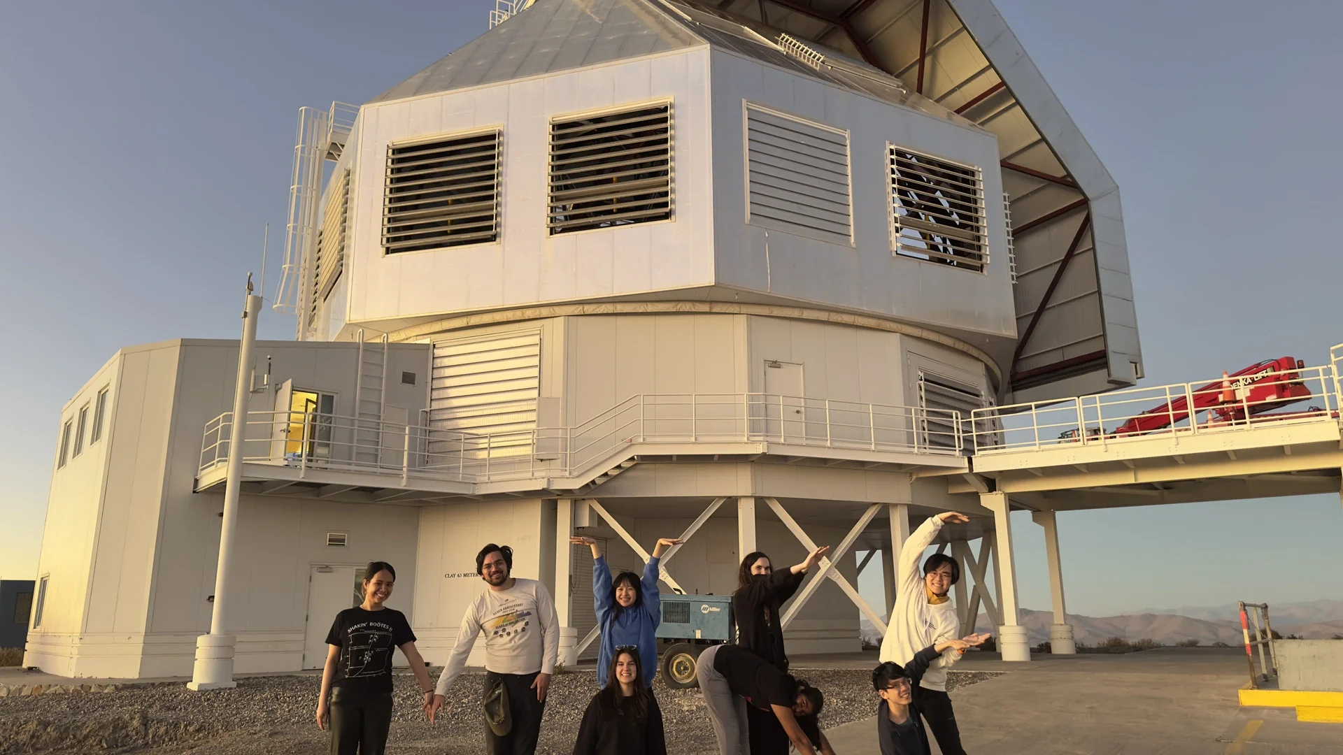 Students from University of Chicago professor Alexander Ji’s “Field Course in Astrophysics” class pose in front of the Magellan Clay telescope at Carnegie Science’s Las Campanas Observatory in Chile. They are using their bodies to spell MIKE, referencing the Magellan Inamori Kyocera Echelle (MIKE) spectrograph instrument that they used on the telescope to make their breakthrough discovery. 