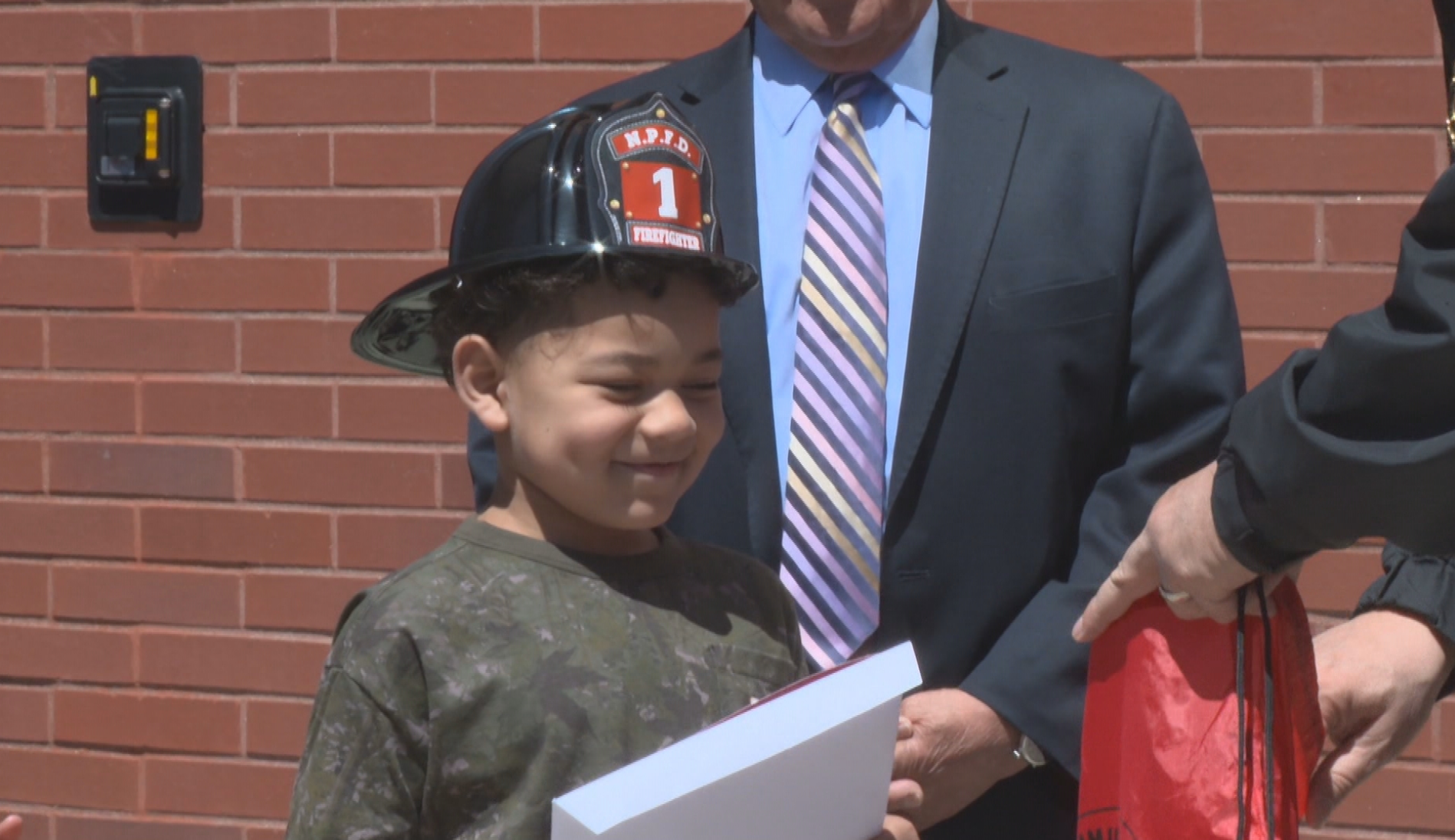 A 7-year-old boy is being hailed as a hero, after he saved his classmate using the Heimlich maneuver at Stephen Olney Elementary School in North Providence.