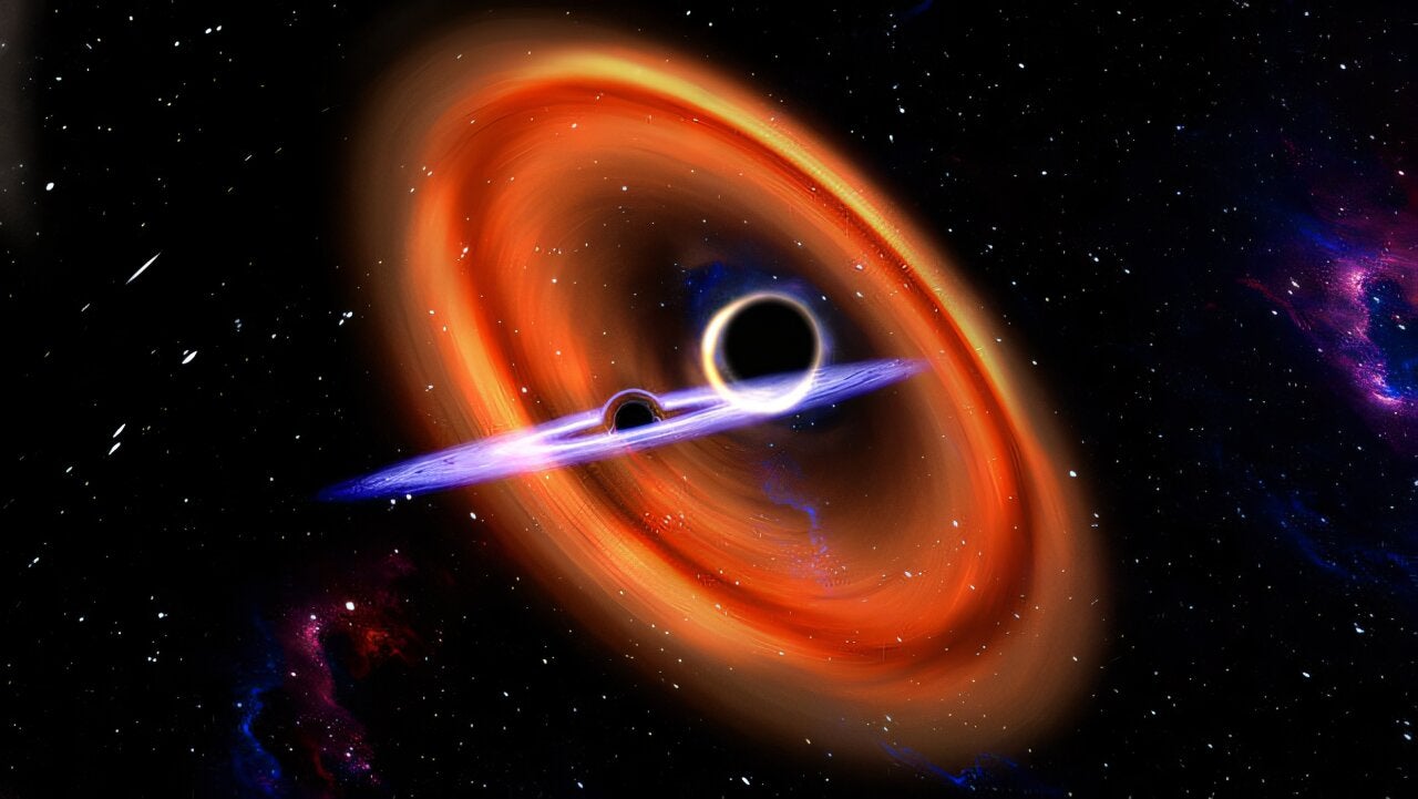Artist's impression of a pair of black holes merging, involving one with unusual spin. 