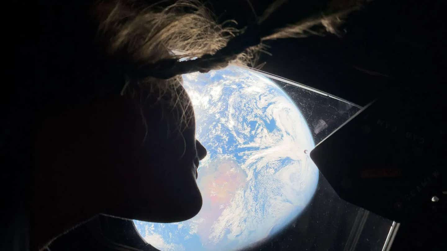 Astronaut Christina Koch watching Earth from the Orion spacecraft (image taken with iPhone 17 Pro Max)