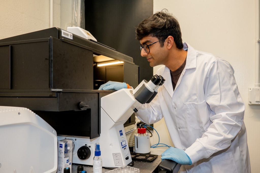 Doctoral candidate Vinayak Vinayak prepares to image a sample of chromatin, the folded state of DNA inside the nucleus. 