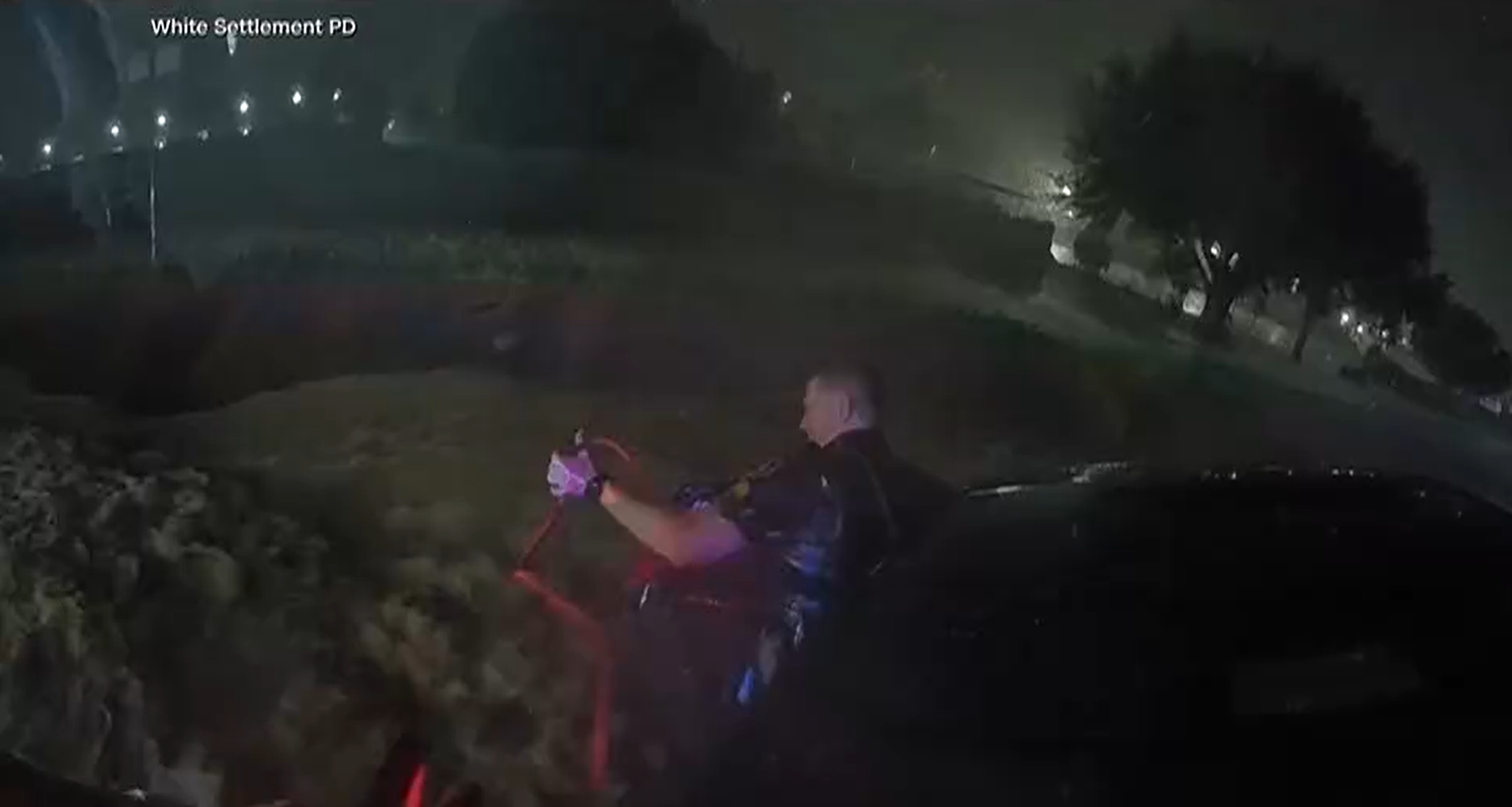 Police used jumper cables as a an improvised lifeline to save a mother from raging floodwaters. 