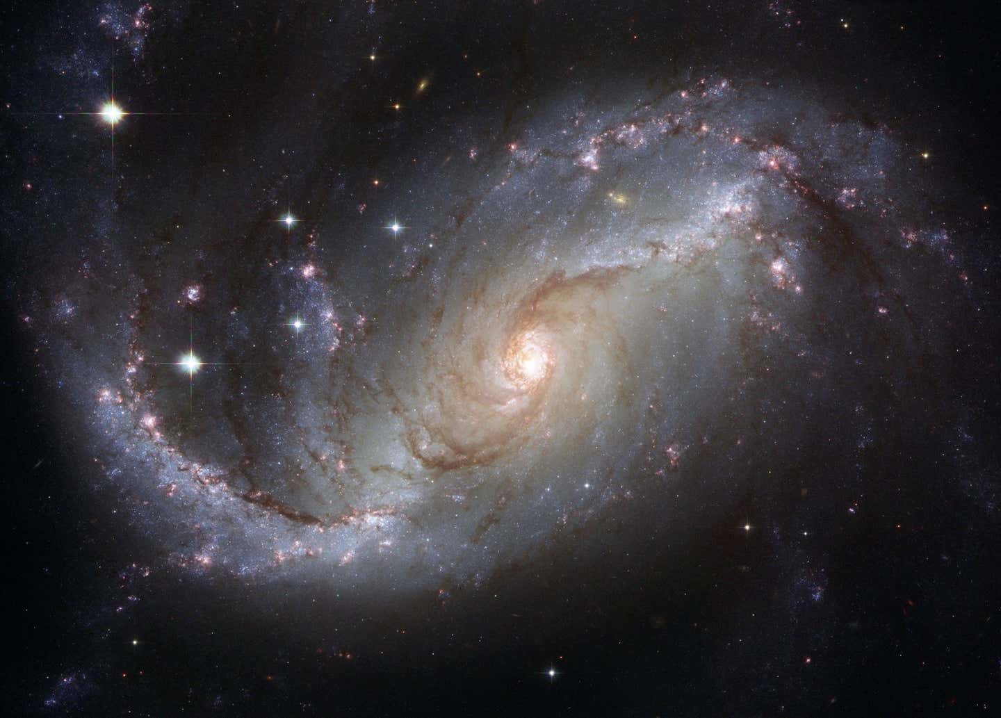 A new cosmology model suggests the universe may be 26.7 billion years old, reshaping how JWST’s earliest galaxies are understood.