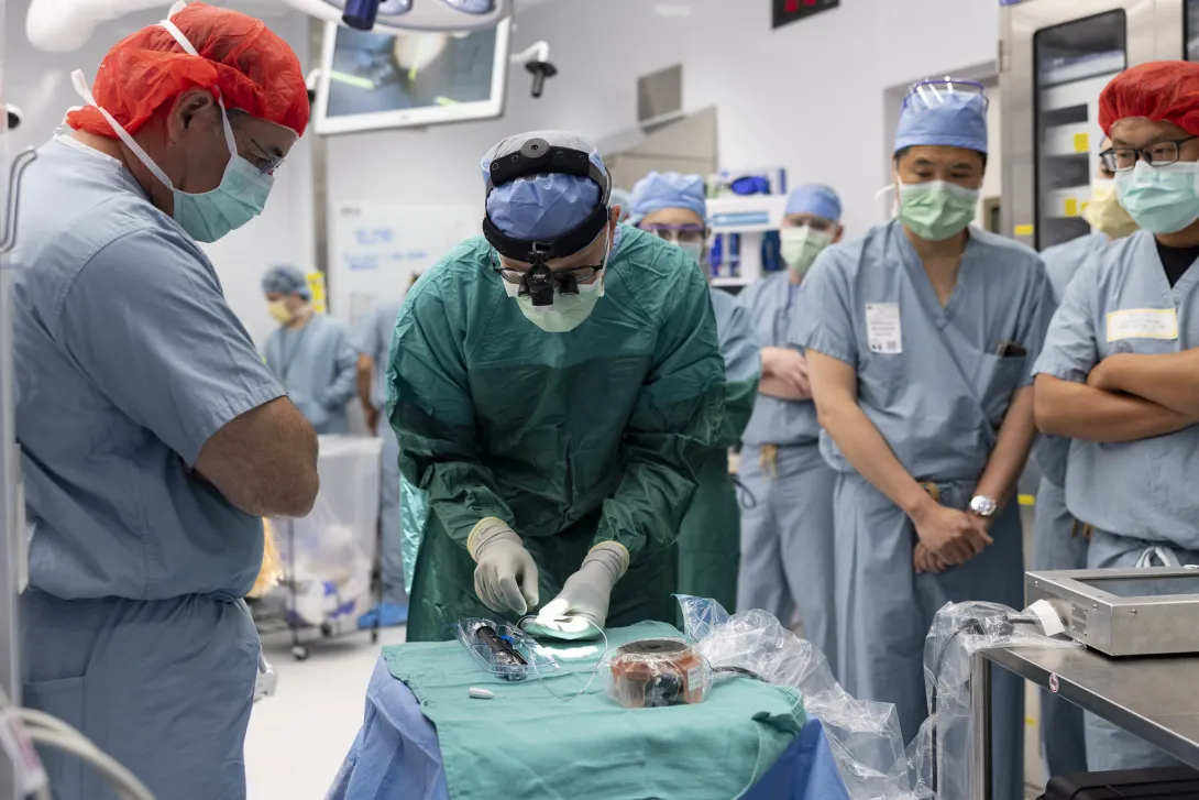 Dr. Matthew Willsey connects the internal and external transceivers to test the device diagnostics.