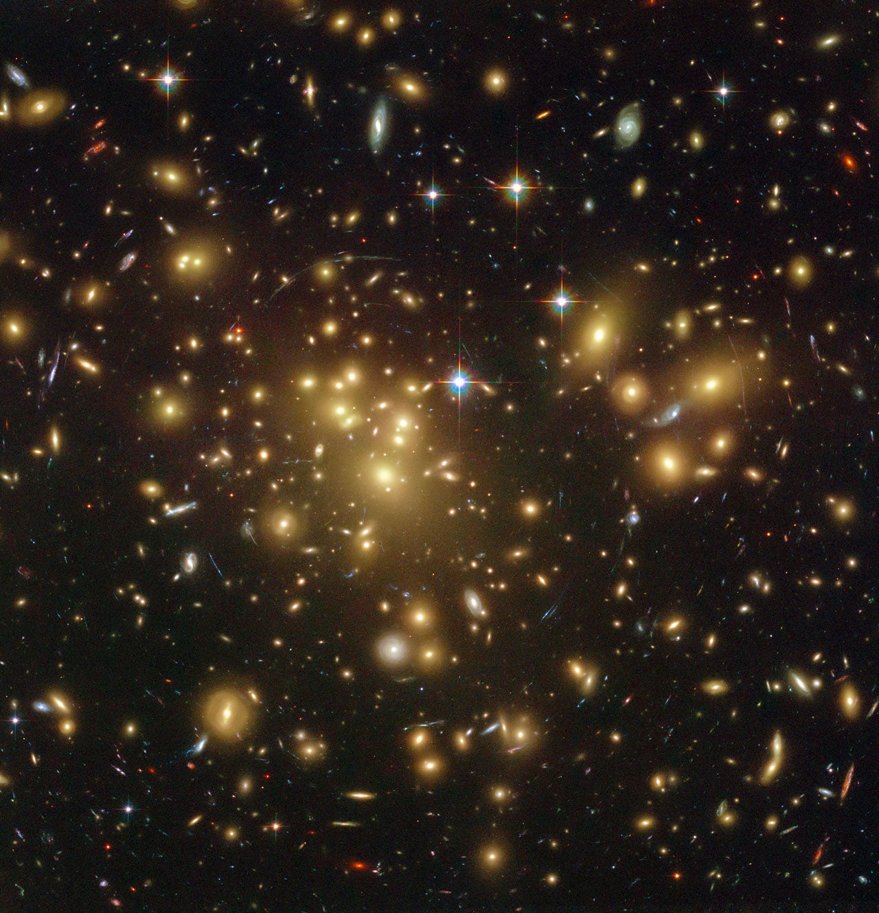 New observations with ALMA and ESO’s VLT have revealed that A1689-zD1 is a dusty galaxy seen when the Universe was just 700 million years old.
