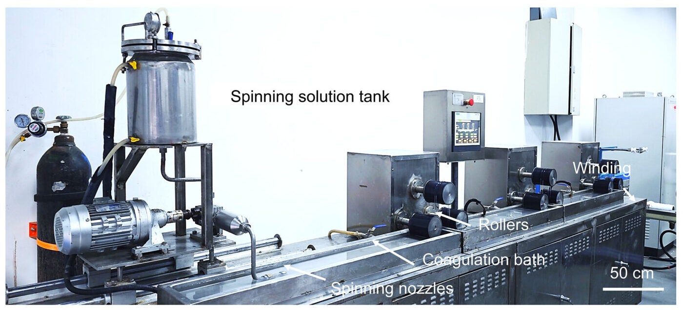 A photograph depicting the industrial-scale fabrication of HOP-Fiber-4. 